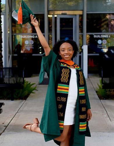 photo of briona carswell in cap and gown outside famu-fsu engineering