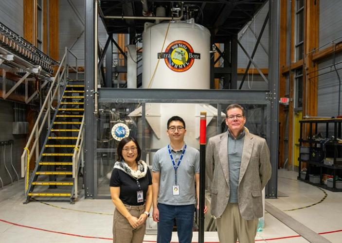 group photo of researchers at the national high magnetic field laboratory in front of sam grant research magnet