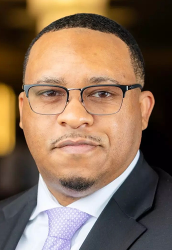 man with glasses in suit