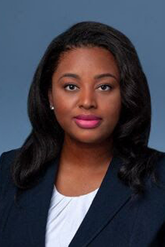 headshot of woman in blue suit