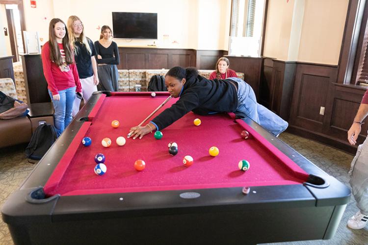 photo of female students playing pool