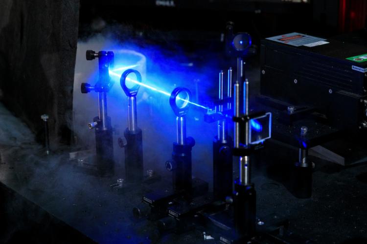 A laser beam is directed into a liquid helium cryostat in the National High Magnetic Field Laboratory in Tallahassee, Florida on May 13, 2025.