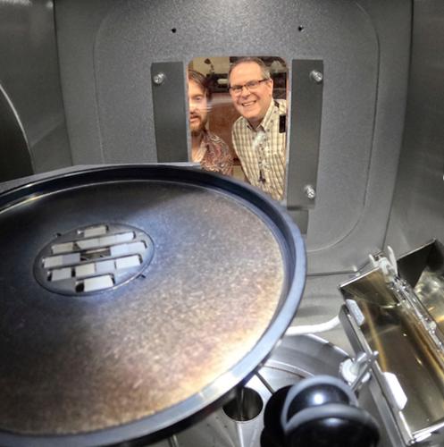 photo of lance cooley looking at the dark matter particle detector