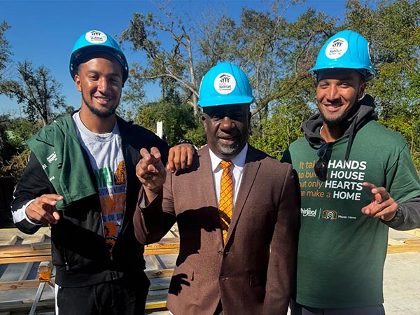 photof jordan and jaydan crawford with interim famu president tim beard at habitat construction site