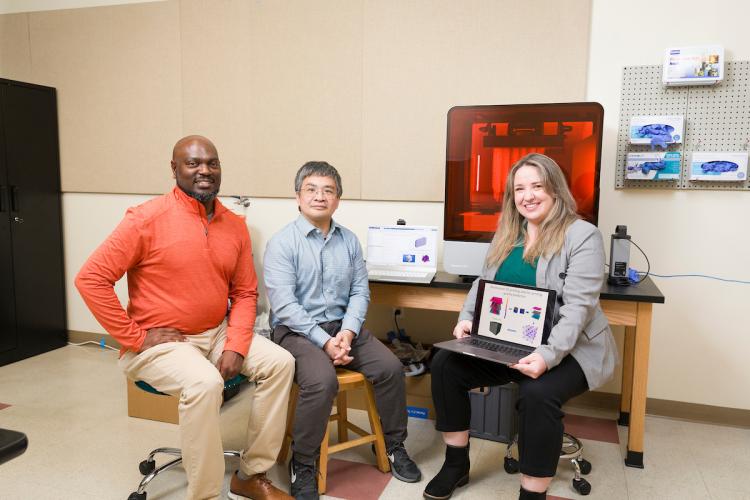 From left, Associate Professor Tarik Dickens, Associate Professor Hui Wang, and Assistant Professor Rebekah Downes pose in a lab in the High-Performance Materials Institute in the Materials Research Building at FAMU-FSU College of Engineering.
