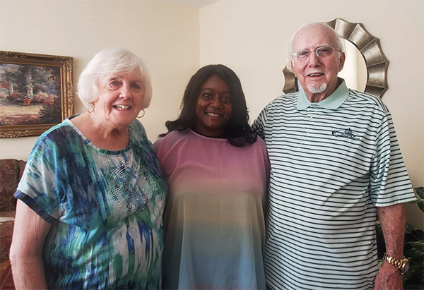 photo of kathy simons, prof shonda bernadin and fred simons jr at home