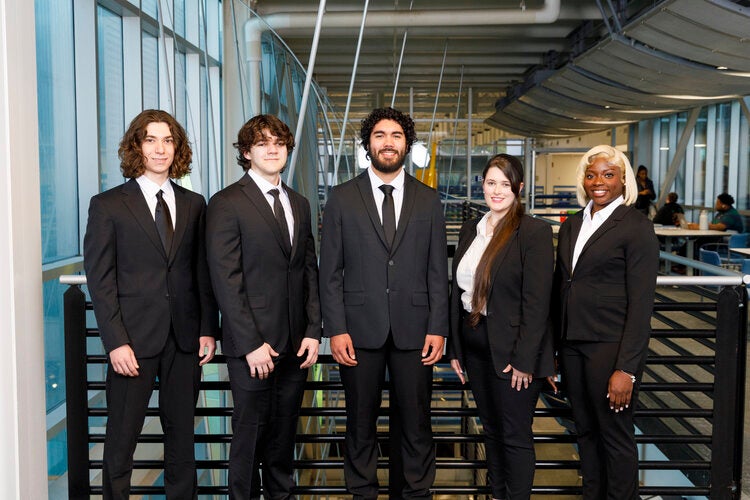 Members of Team 527 left to right: Samuel Artecona, Nicholas Brown, Lucas Girala, Cricket Skipper, Rhonda Smith