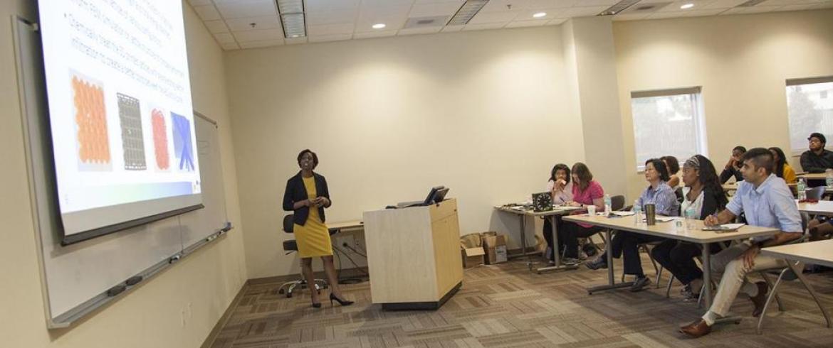 Student presenting her hybrid business/research pitch (via powerpoint presentation)