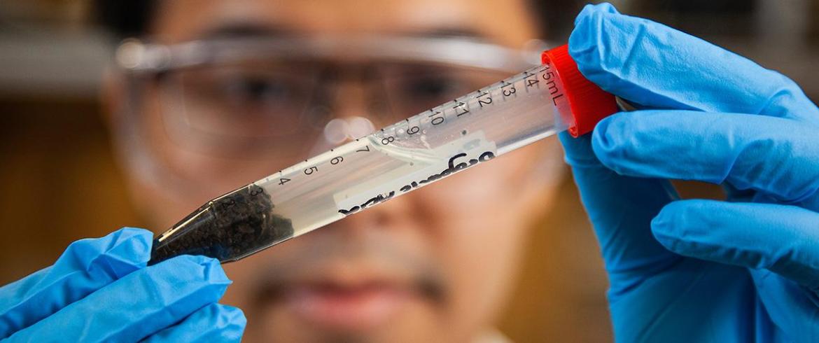 Runwei Li looks over the separation of waste solids 