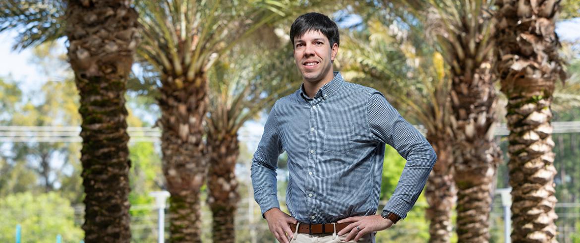 photo of civili engineering professor pedro fernandez-caban in front of palm trees at the famu-fsu college of engineering