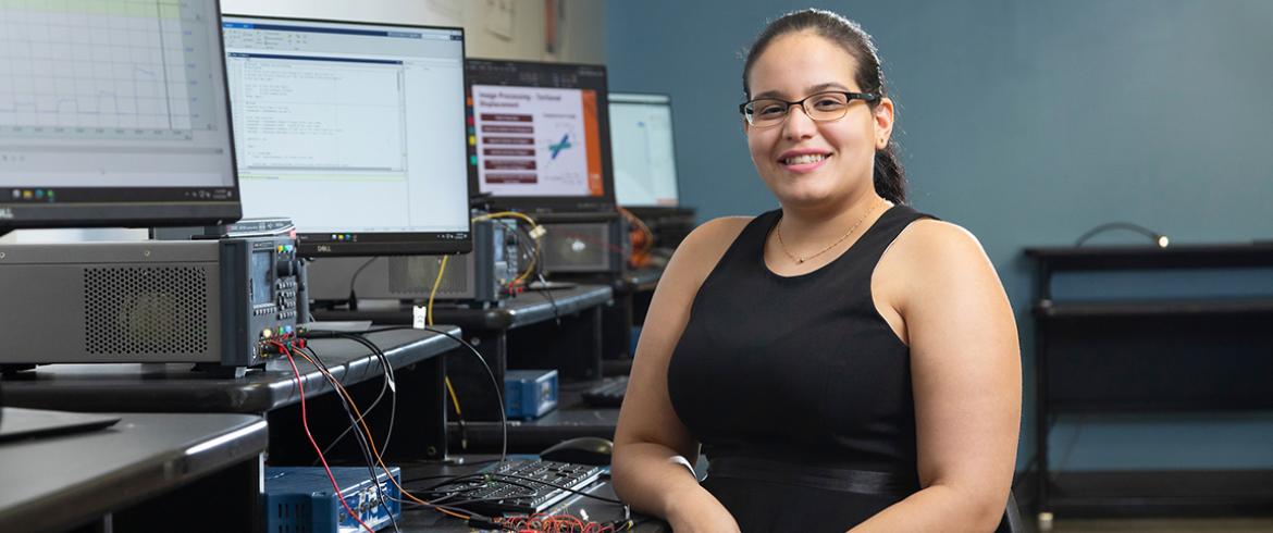 portrait of young engineering student in black dress in computer lab at famu-fsu engineering