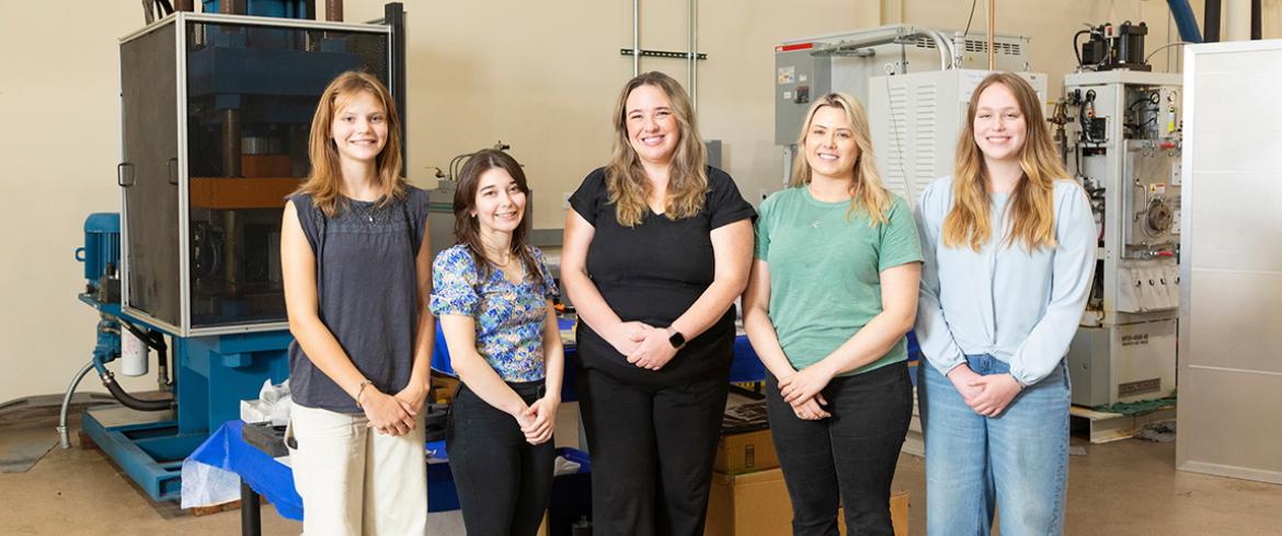 photo of famu-fsu engineering professor rebekah sweat and her team of graduate students and high school interns in the lab at HPMI