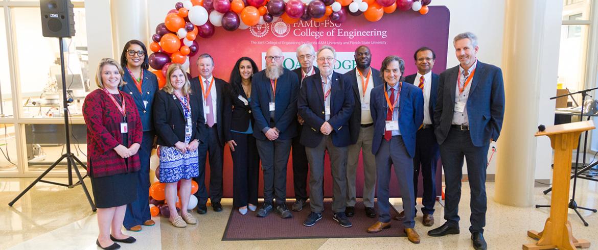 photo of group of people in front of background