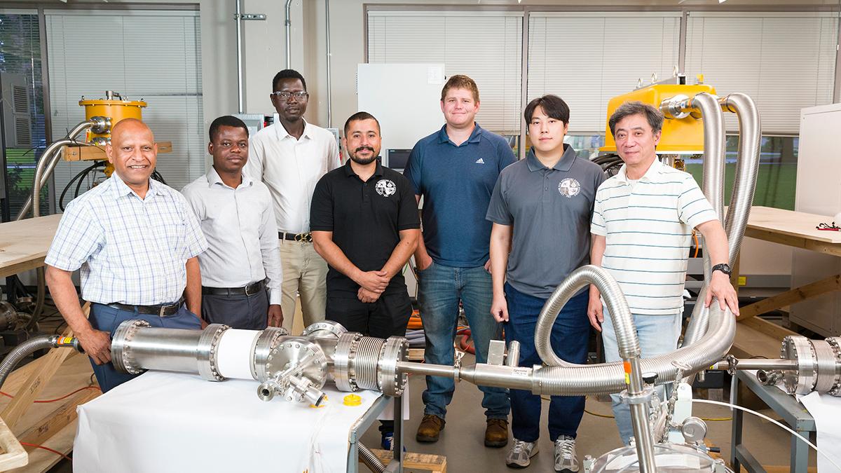 CEC-ICMC 2025 conference crew in the lab at CAPS