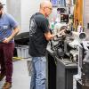 photo of two professional engineering machinists at work in machine shop