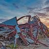 photo of building destroyed by hurricane at sunset