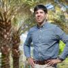 photo of civili engineering professor pedro fernandez-caban in front of palm trees at the famu-fsu college of engineering